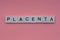 Word placenta from small gray wooden letters