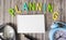 The word Planning consists of colored letters, next to a notepad for writing, a magnifier and an alarm clock