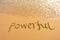 Word powerful draw on beach
