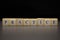 The word PRACTICE written on wooden cubes isolated on a black background