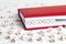 Word Priority written in wooden blocks in red notebook on white