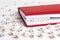 Word Private written in wooden blocks in red notebook on white w