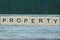 Word property made of brown wooden letters