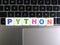 Word Python on keyboard background