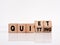 The word quiet quitting on wooden cubes. Business employment concept