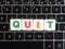 Word Quit on keyboard background