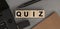 Word QUIZ made with wood building blocks. Top view