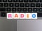 Word Radio on keyboard background