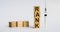 Word RANK written with wooden blocks, next to it is a syringe - a threat to life, a medical concept