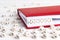 Word Recycle written in wooden blocks in red notebook on white w