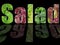 the word salad with various lettuces in letter shape isolated on black background