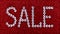 Word SALE is made rhinestones crystal color on a red canvas back