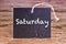 The word Saturday written on chalk board