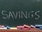 The word Savings written in chalk