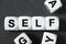 Word self on toy cubes