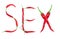Word sex written from red hot pepper letters isolated on white background