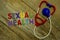 Word SEXUAL HEALTH colorful wooden alphabet letters set and toy stethoscope on wooden background. Healthcare and medical concept