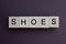 Word shoes made of wooden square letters