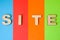 Word Site of volumetric letters is background of four colors: blue, red, orange and green. Visualizing concept of site as collecti