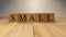 The word small created from wooden cubes.