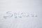 Word "snow" written on snow