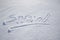 Word "snow" written on the snow