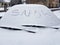 The word snow written on a snow-covered car window. Snow-covered cars in the winter. Cold weather. Dirty road traffic