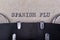 The word spanish flu written in typewriter font. The inscription in the old style on gray paper