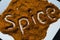 Word spice written on red chili powder