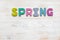 Word spring written in wooden made letters on wood vintage background