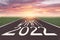 The word start 2022 written on asphalt road at sunrise, New life change 2022 plan concept, Concept for new year 2022