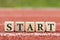 The word START made from wooden cubes