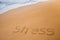 The word STRESS written in the sand