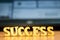 The word `success` made of wooden letters