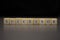 The word SUCCESSOR written on wooden cubes isolated on a black background