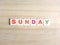 Word Sunday on wood background