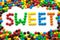 The word sweet, made from colored candies