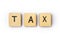 The word TAX