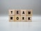 The word TEAM WORK written on wooden cubes