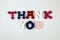 The word Thank You formed with colorful felt letters