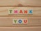 Word Thank You on wood