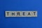 The word threat from brown wooden letters