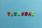 Word `thursday` of colored plastic magnetic letter on blue paper background.
