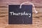 The word Thursday written on chalk board
