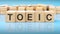 word toeic made with wood building blocks, business concept