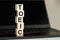 The word TOEIC in wooden cubes on the keyboard