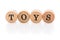 Word Toys from circular wooden tiles with letters children toy.