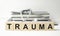 The word trauma written on wooden cubes