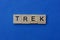 Word trek made of brown wooden letters