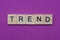 Word trend from small gray wooden letters